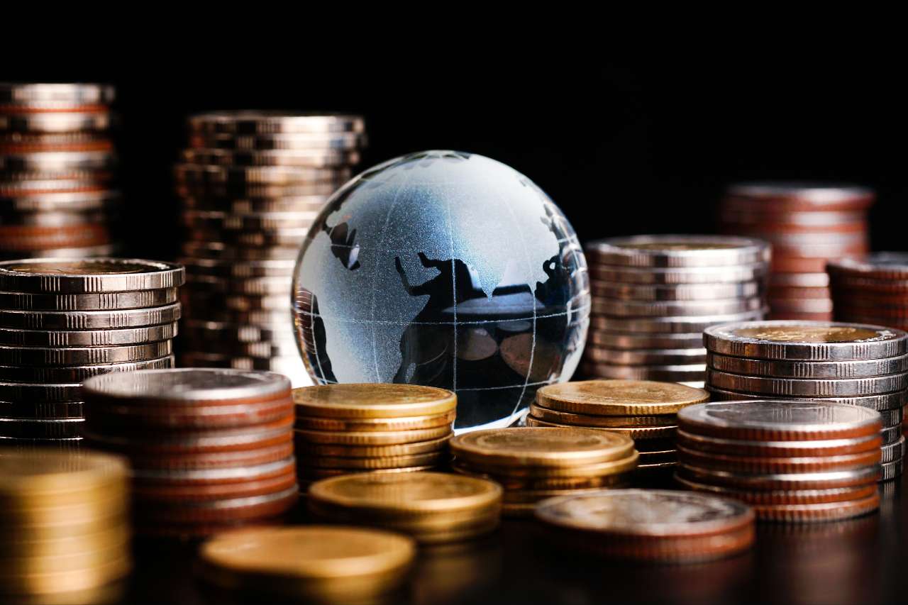 Globe with Money on the table representing FX solutions